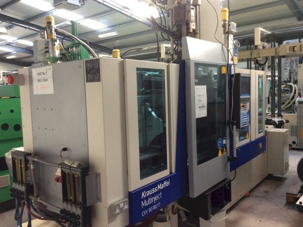 Makine  Krauss Maffei Multinject 80-180-55 CX V - Önden görünüm