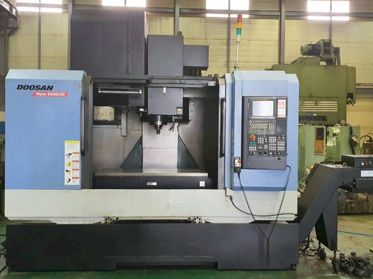 Makine  Doosan Mynx 6500/50 - Önden görünüm