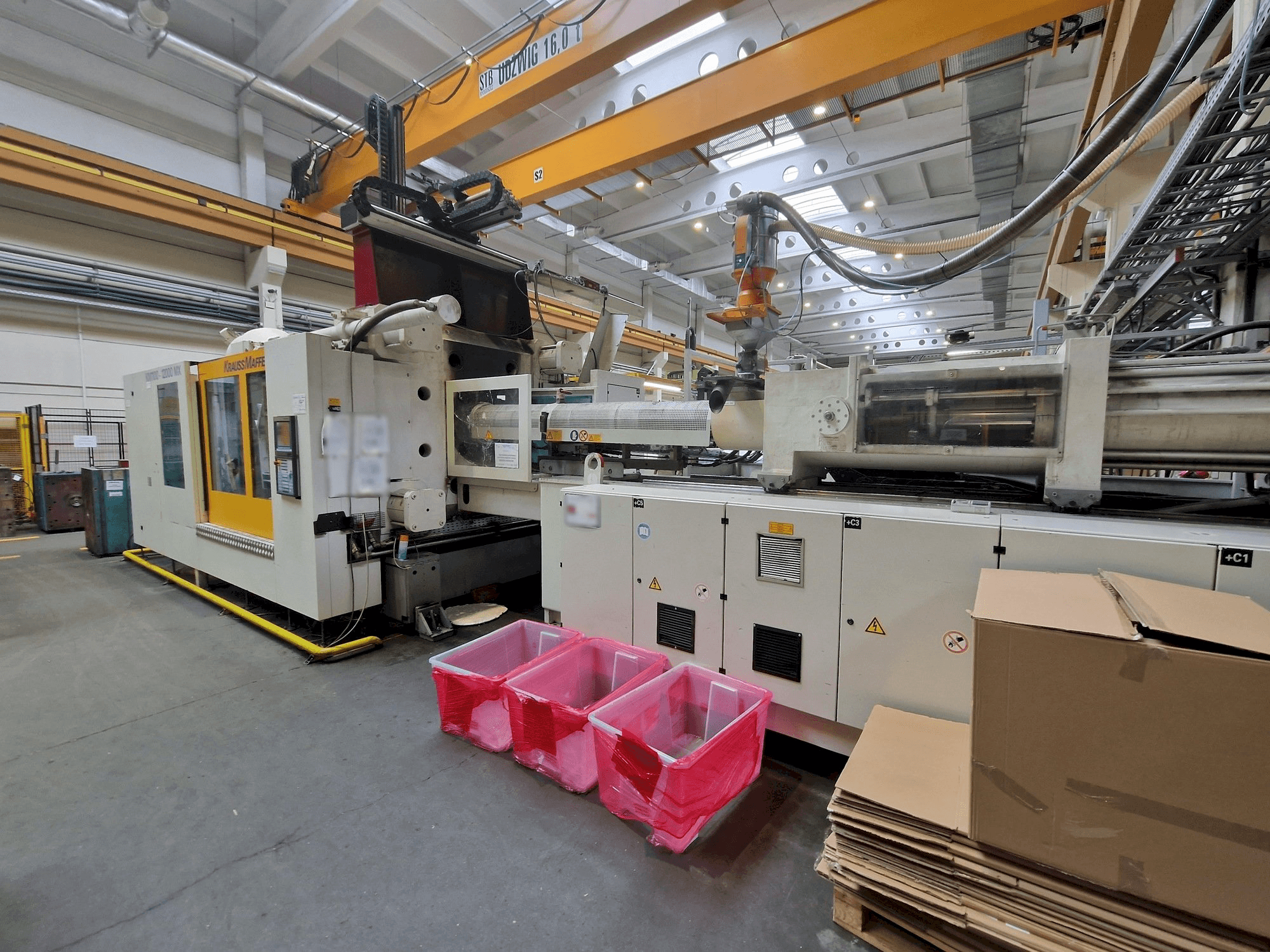 Makine Krauss Maffei 1100-12000 MX - Önden görünüm